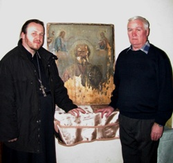 отец Димитрий и староста храма  А.А.Роженцов возле иконы Николая Чудотворца.
